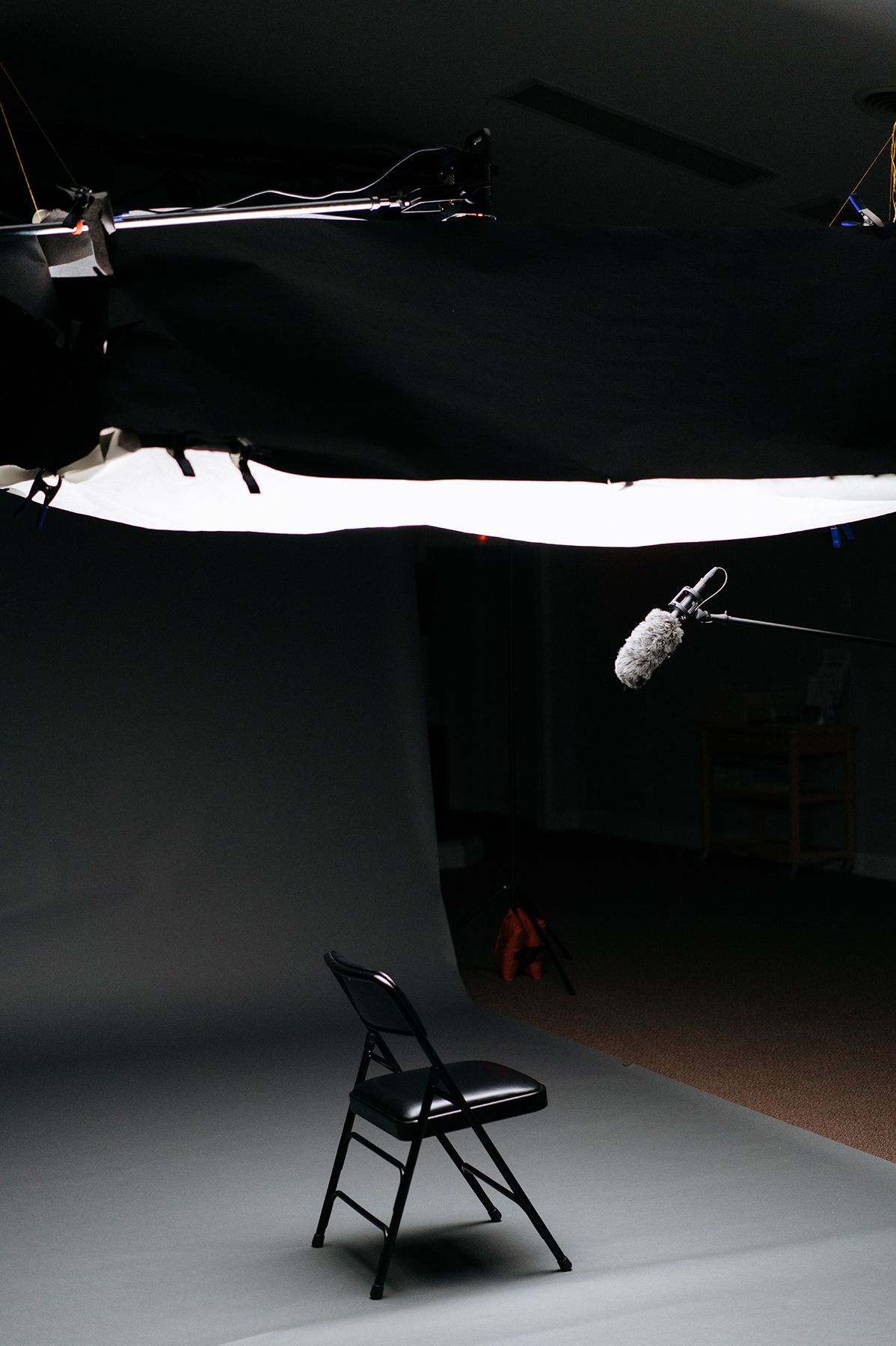 Chair on a seamless background with a microphone overhead